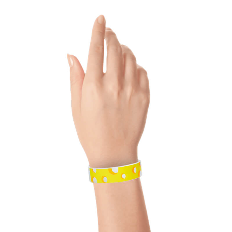 Hand wearing a cheese designed tyvek wristband