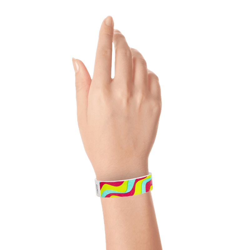 aqua, neon red, neon yellow wavy stripe pattern on a tyvek wristband shown on a wrist