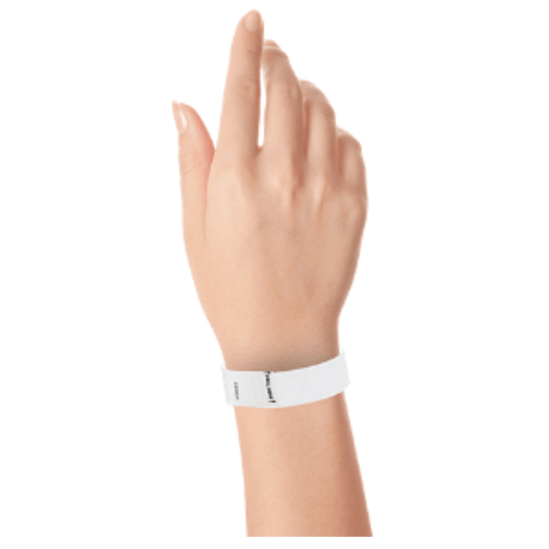 hand wearing a litter free tyvek 3/4" wristband in white