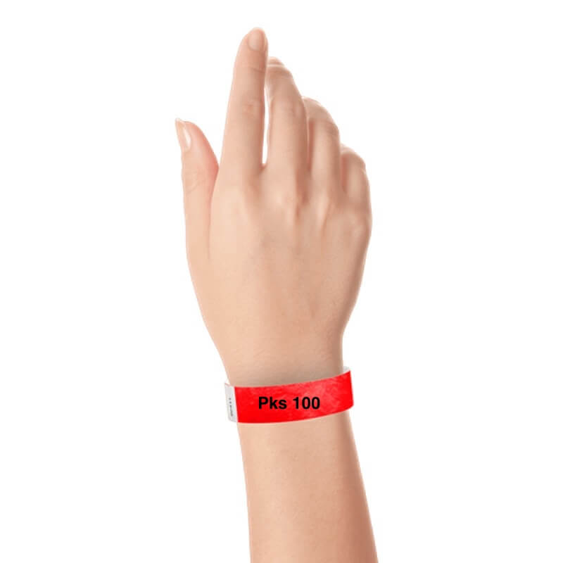 a hand wearing tyvek 3/4" solid wristband neon red pks 100