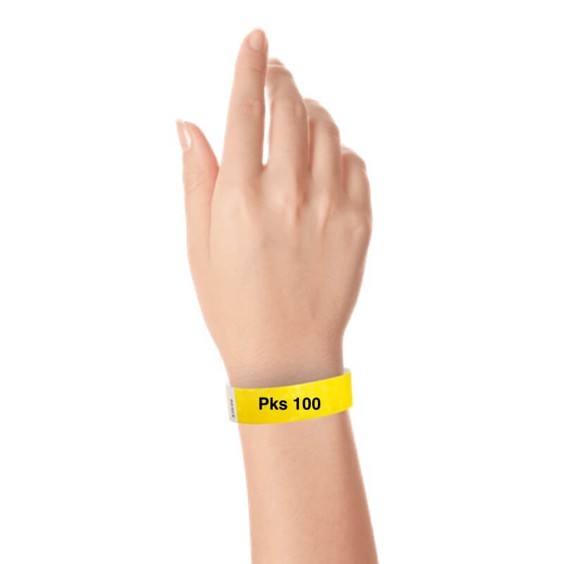 a hand wearing tyvek 3/4" solid wristband pantone yellow pks 100