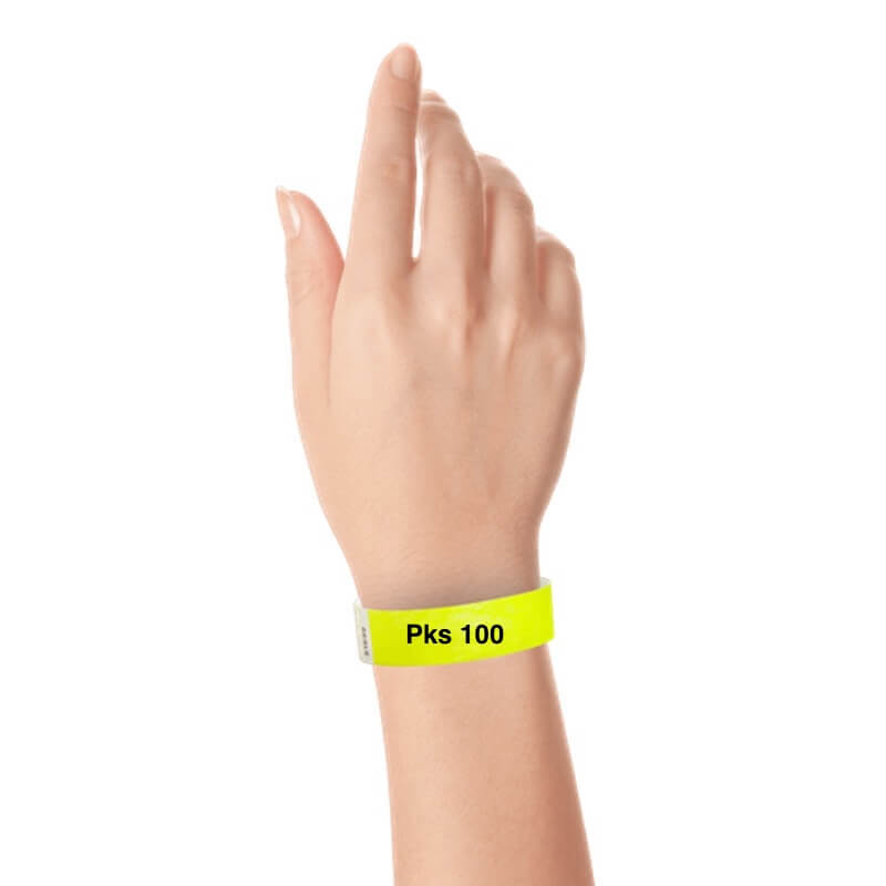 a hand wearing tyvek 3/4" solid wristband neon yellow pks 100