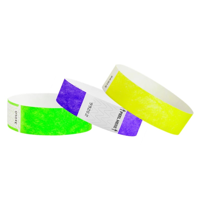 solid 3/4" tyvek wristbands shown in qwik fit neon green, litter free purple and solid neon yellow