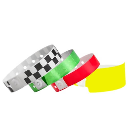 plastic stock wristbands show in checkerboard black, holographic green, regular neon red and wide face neon yellow