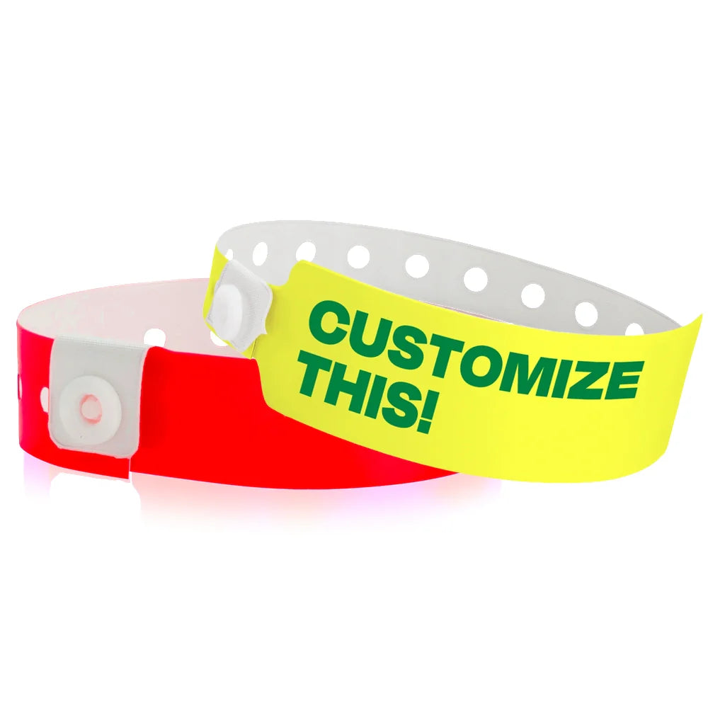 vinyl wristbands shown in regular vinyl neon red and custom wide face vinyl neon yellow