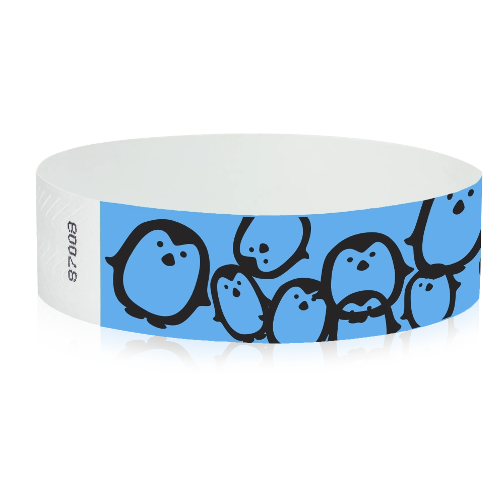 neon blue Tyvek Wristband with black penguins - round version shown