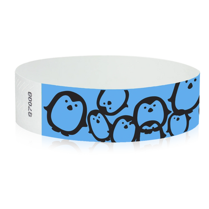 neon blue Tyvek Wristband with black penguins - round version shown