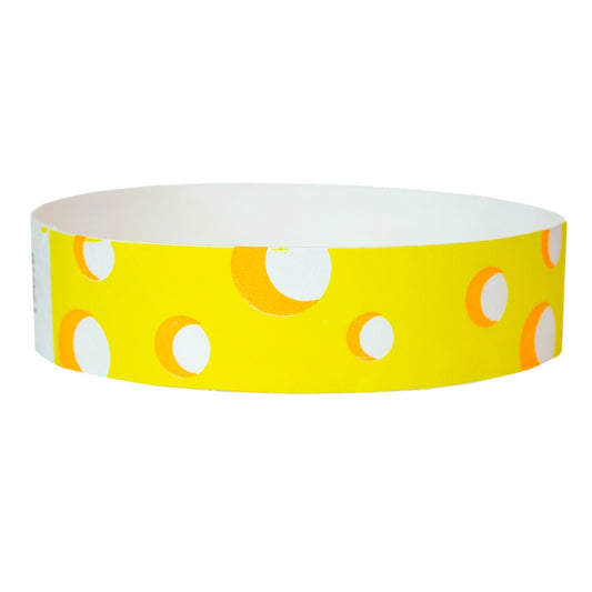 white tyvek wristband with neon yellow cheese pattern - round version shown