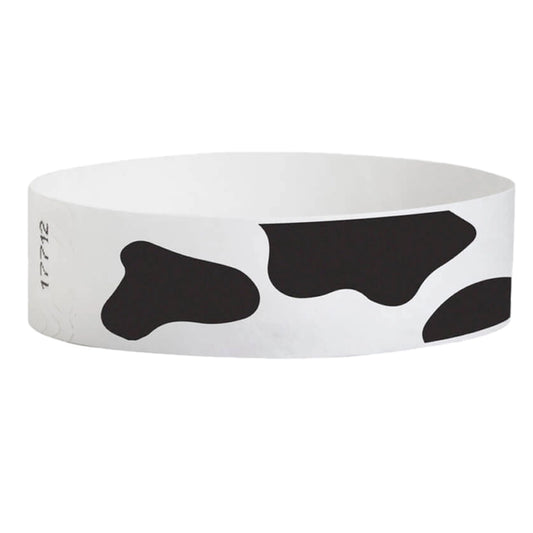 white tyvek wristband with cow pattern - round version shown
