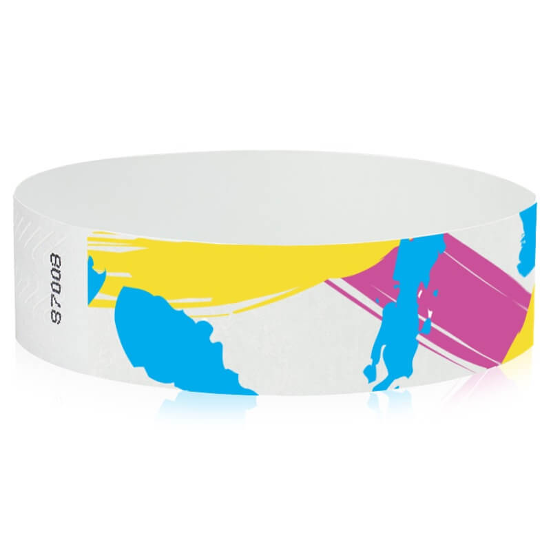 white tyvek wristband with paint stroke pattern in neon blue, neon pink and neon yellow - round version shown