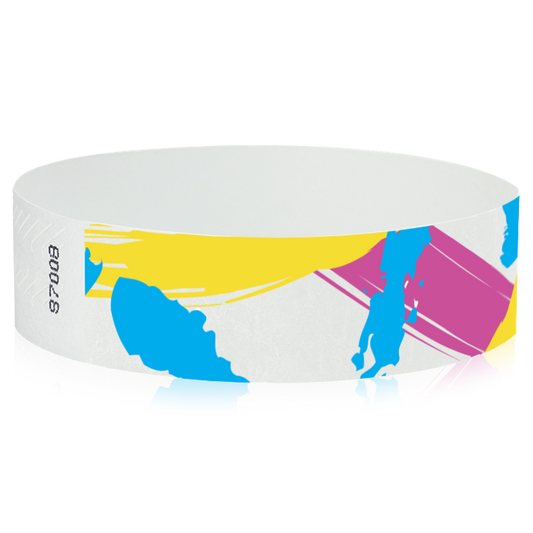 white tyvek wristband with paint stroke pattern in neon blue, neon pink and neon yellow - round version shown