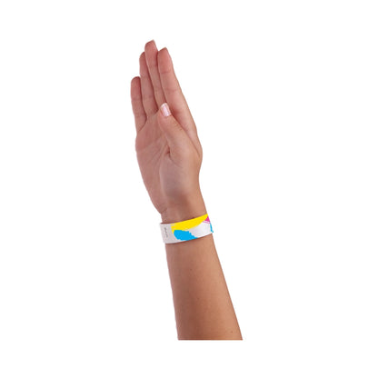 Hand wearing a colourful 90's paintstroke wristband