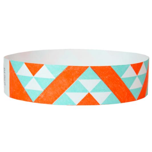 aqua and neon orange aztec pattern on a white tyvek wristband - round version shown