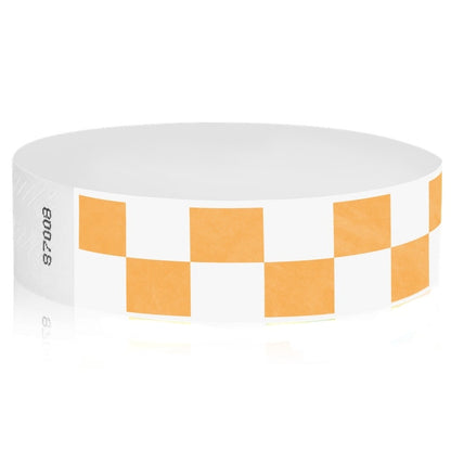 White tyvek wristband with neon orange checkerboard pattern - round version shown