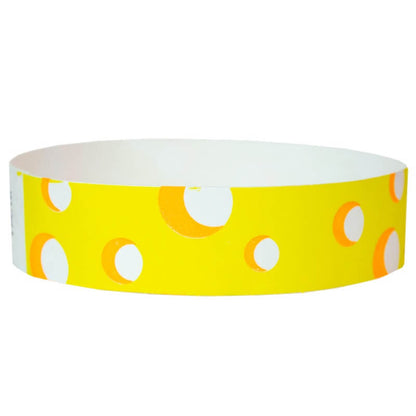 white tyvek wristband with neon yellow cheese pattern - round version shown
