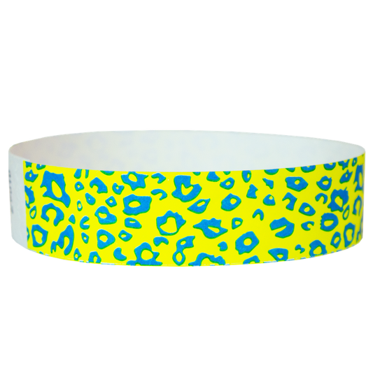 neon yellow tyvek wristband with neon blue cheetah pattern - round version shown