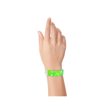 wrist wearing a neon green tyvek wristband in a confetti pattern with neon orange, neon blue, neon yellow and white