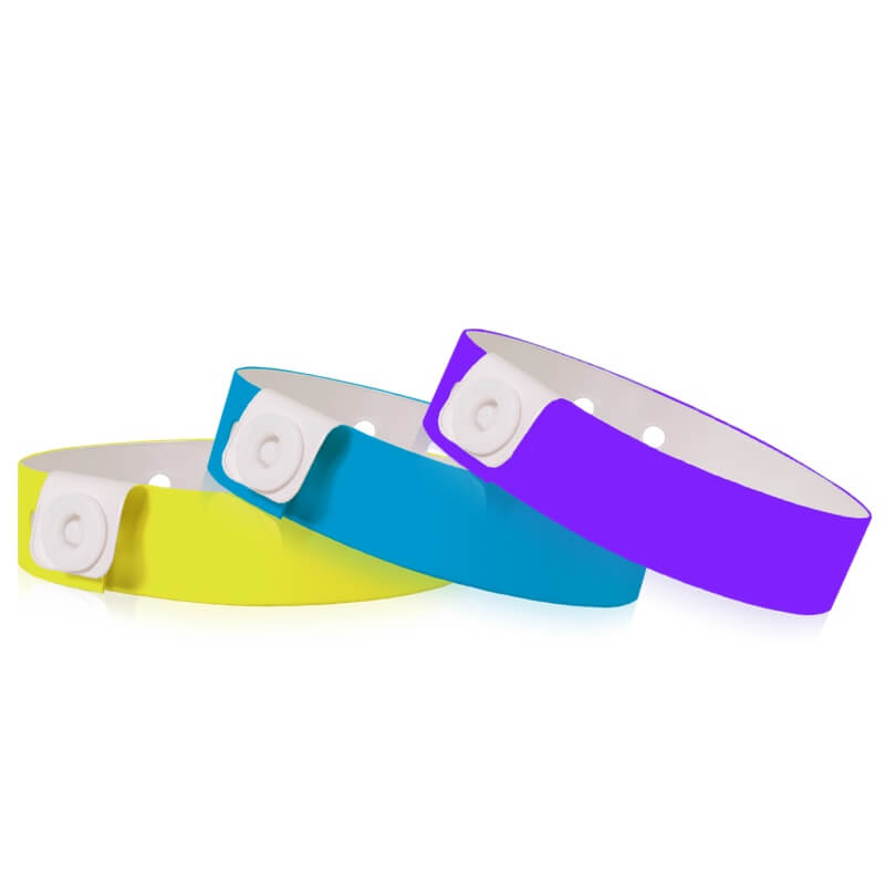 Vinyl slim wristband shown in neon yellow, neon blue and purple