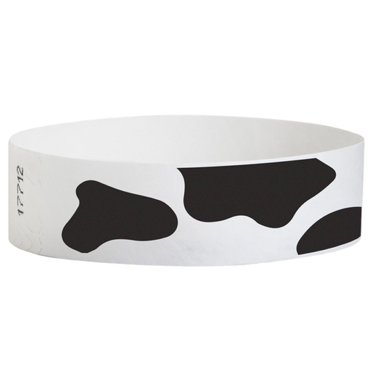 white tyvek wristband with cow pattern - round version shown