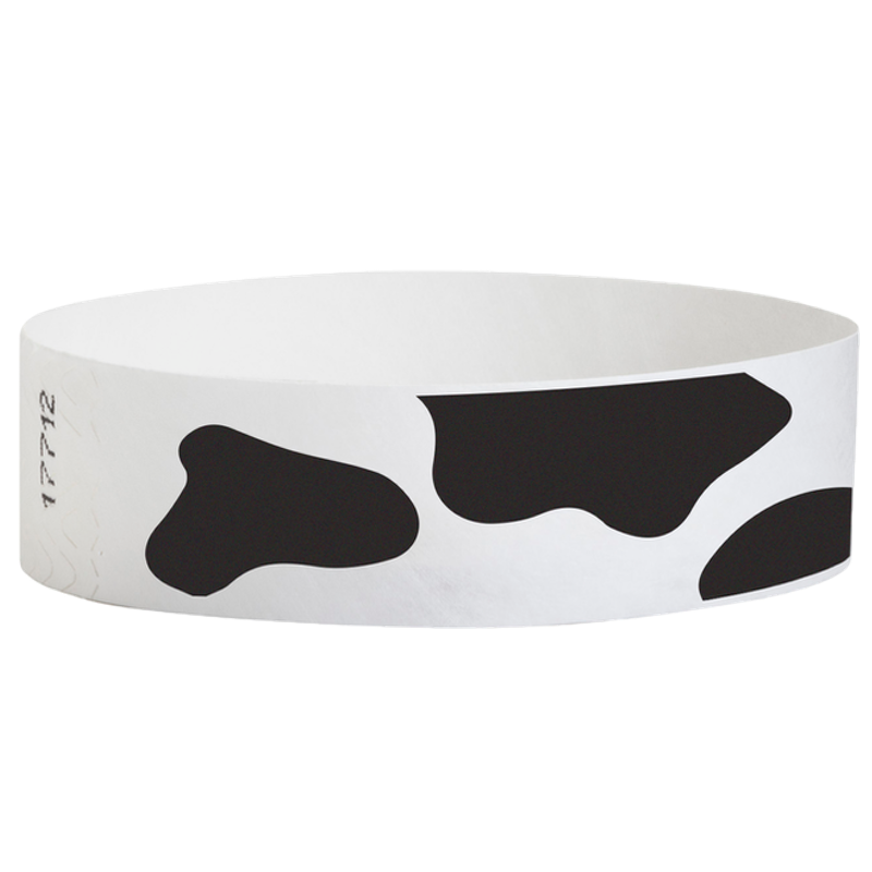 White wristband with black cow print pattern on a white background