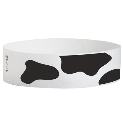 white tyvek wristband with cow pattern - round version shown