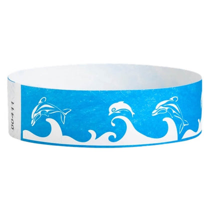 neon blue tyvek wristband with white dolphin and wave pattern - round version shown