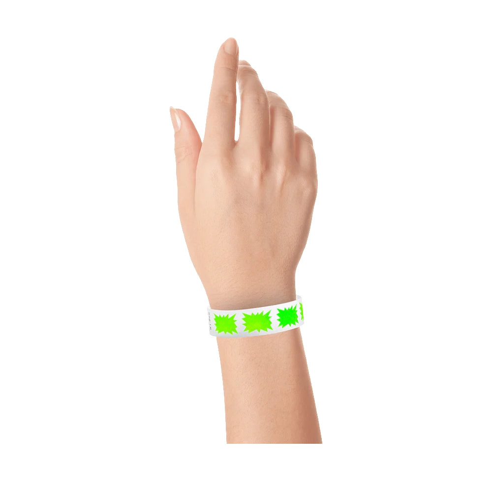 hand wearing a white wristband with neon green burst pattern
