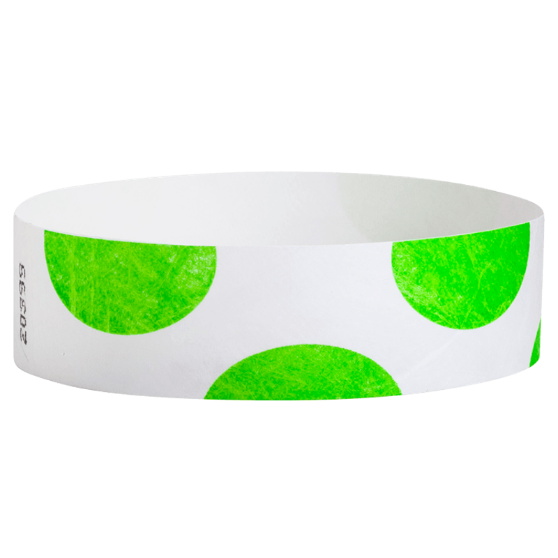 White wristband with green circular patterns on a white background