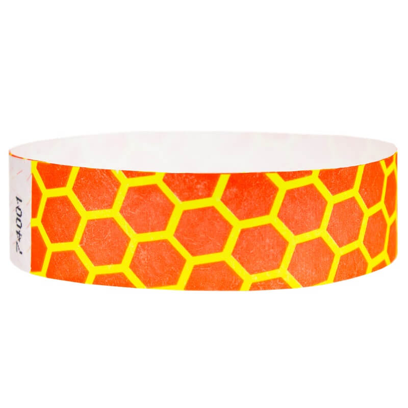 neon orange tyvek wristband with neon yellow honeycomb pattern - round version shown