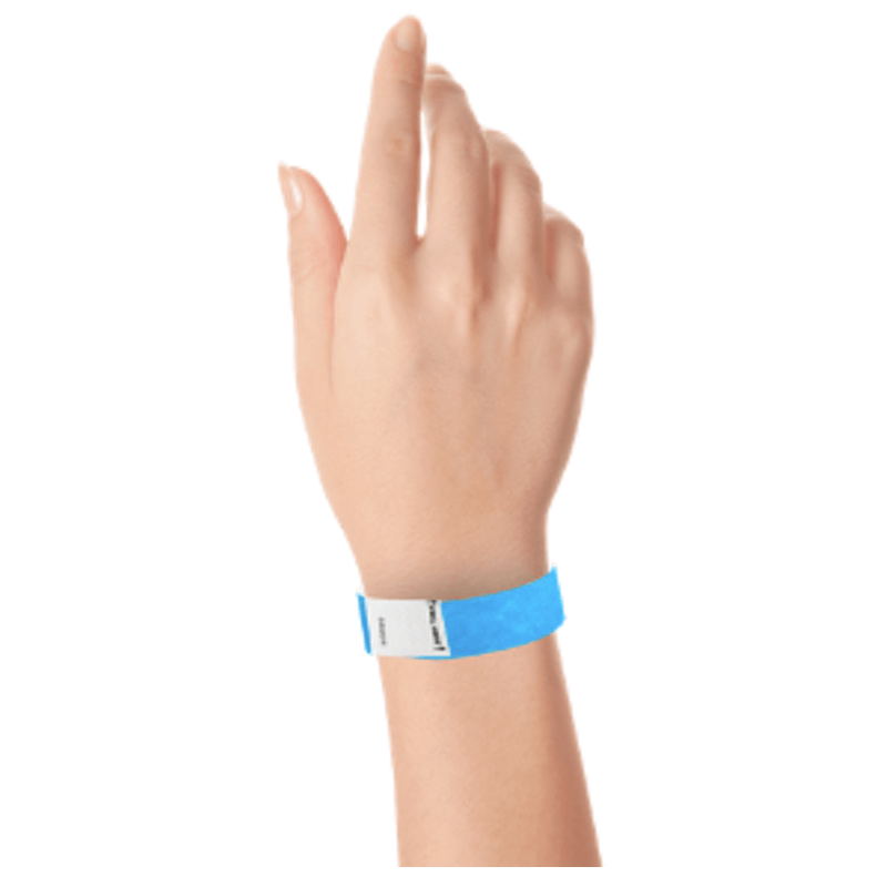 hand wearing a litter free tyvek 3/4" wristband in neon blue