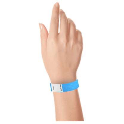 hand wearing a litter free tyvek 3/4" wristband in neon blue