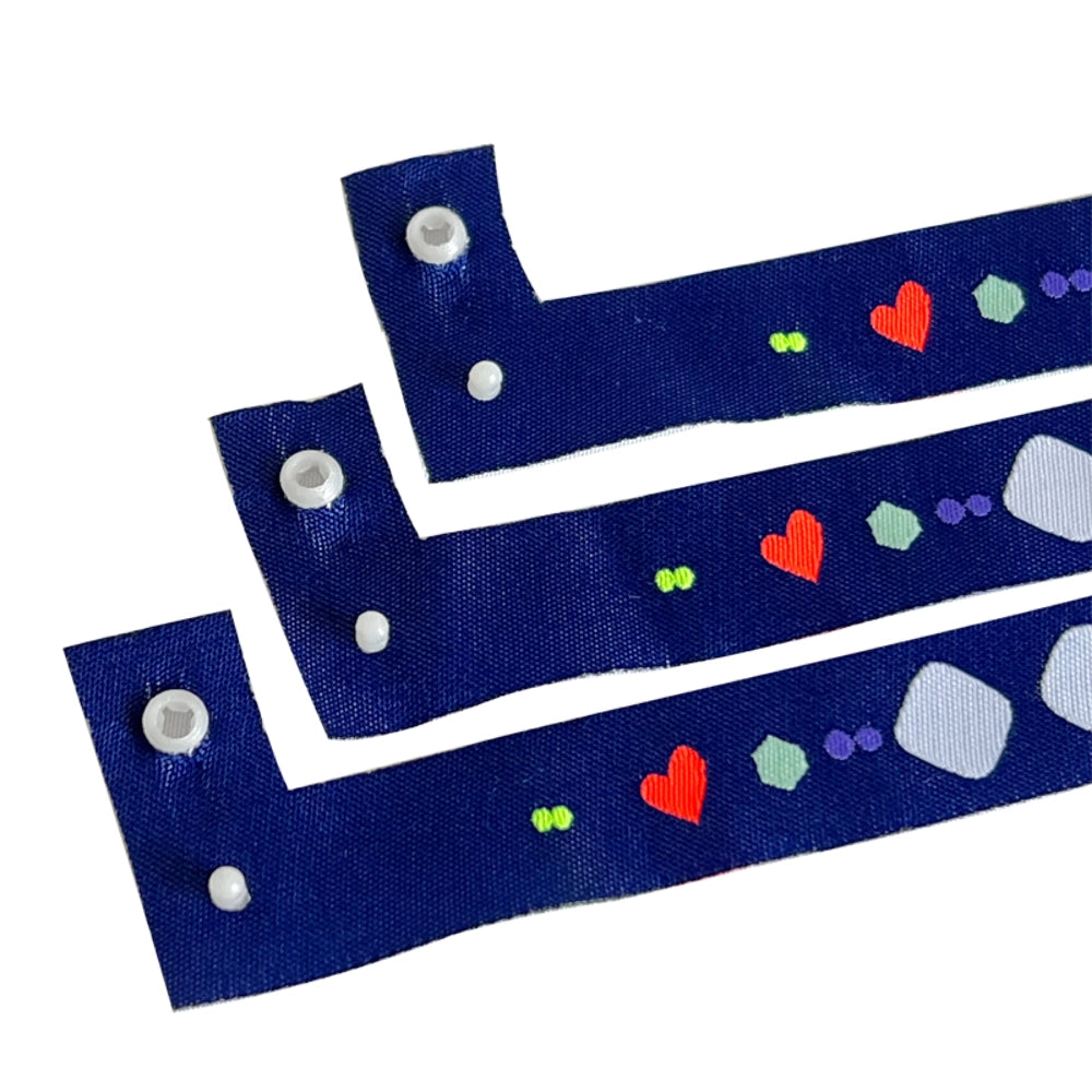 L shape snapped closure cloth wristband in blue with heart pattern
