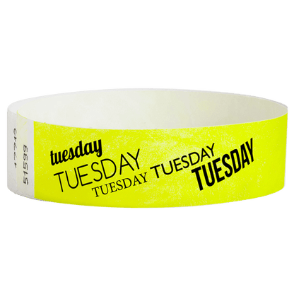 neon yellow tyvek wristband with tuesday text in black ink - round version shown