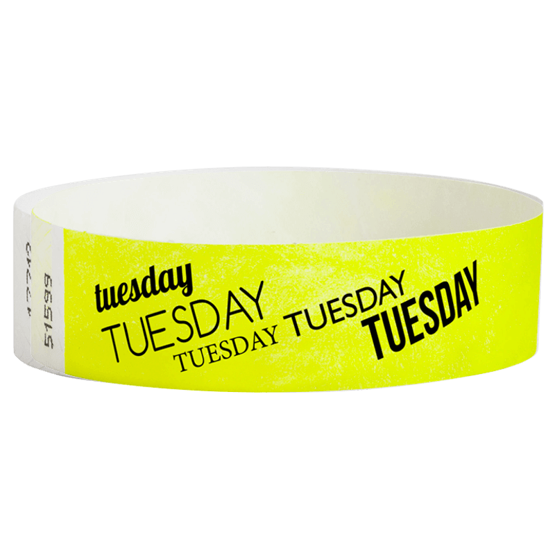 neon yellow tyvek wristband with tuesday text in black ink - round version shown