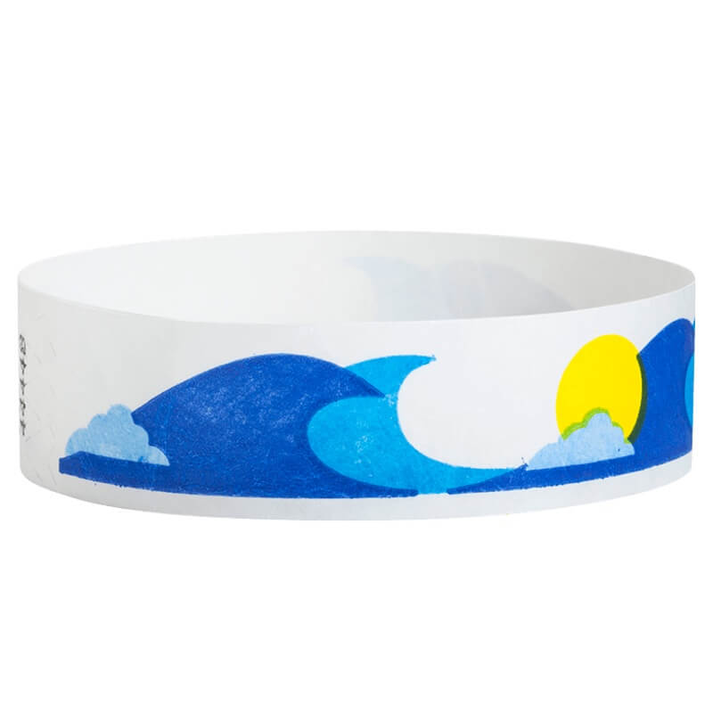 White tyvek wristband with blue wave and yellow sun design - round version shown