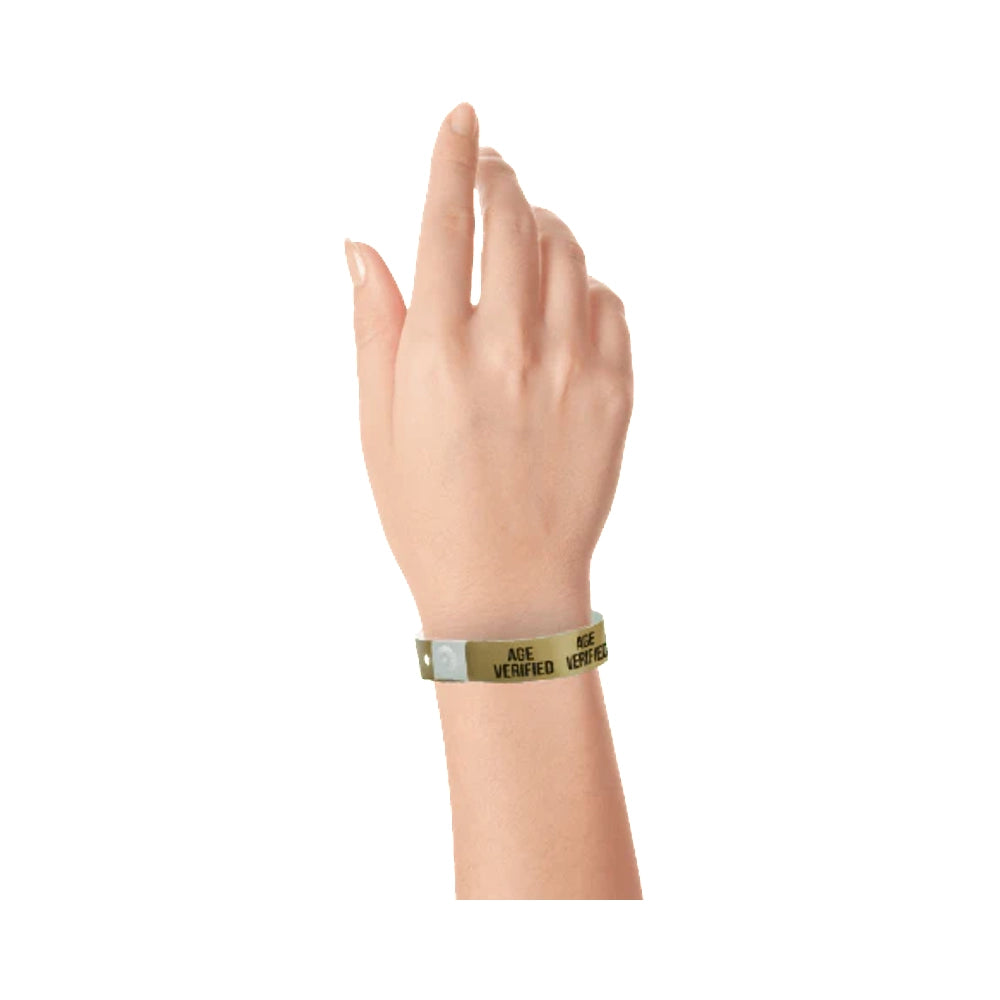 Age verified plastic wristband in gold with text "AGE VERIFIED" printed on the band in black - shown on wrist 