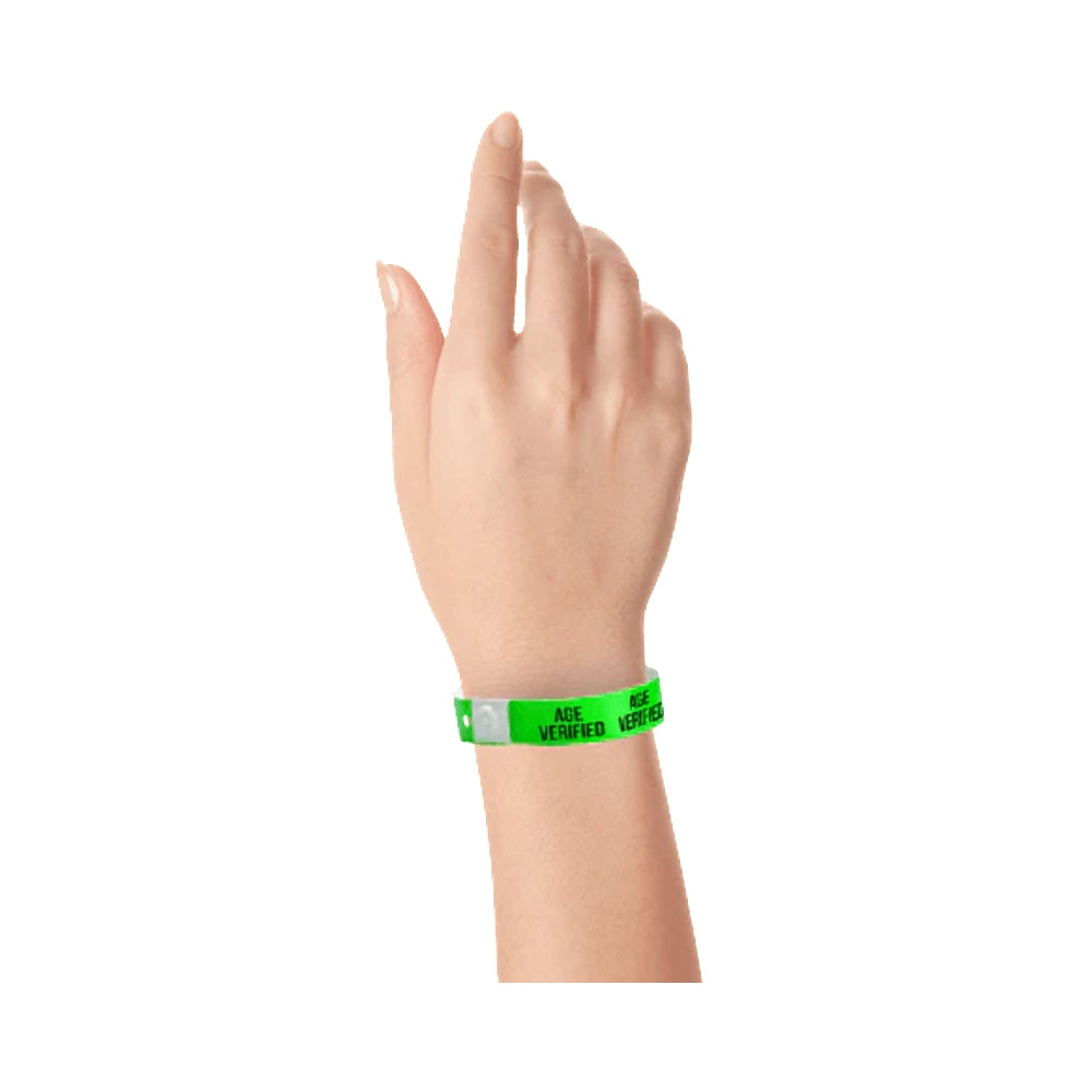Age verified plastic wristband in green with text "AGE VERIFIED" printed on the band in black - shown on wrist 