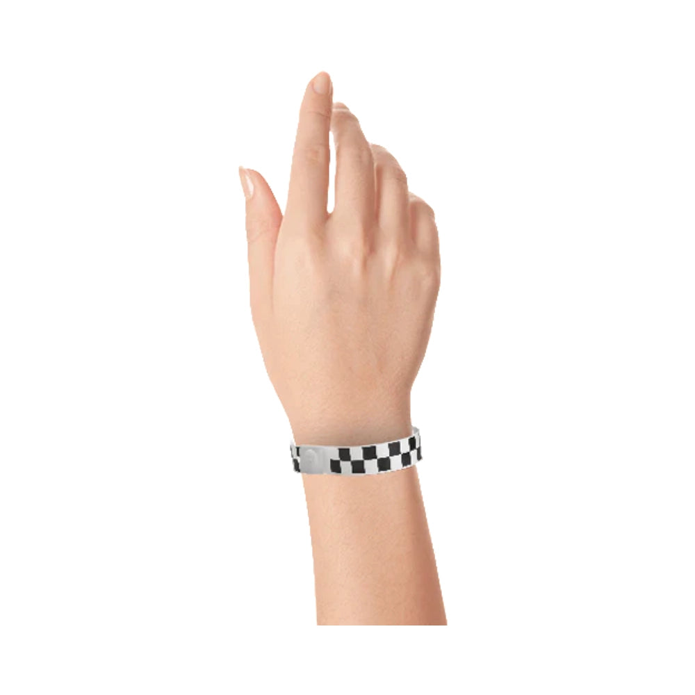 Plastic wristband with a black and white checkerboard pattern - shown on wrist