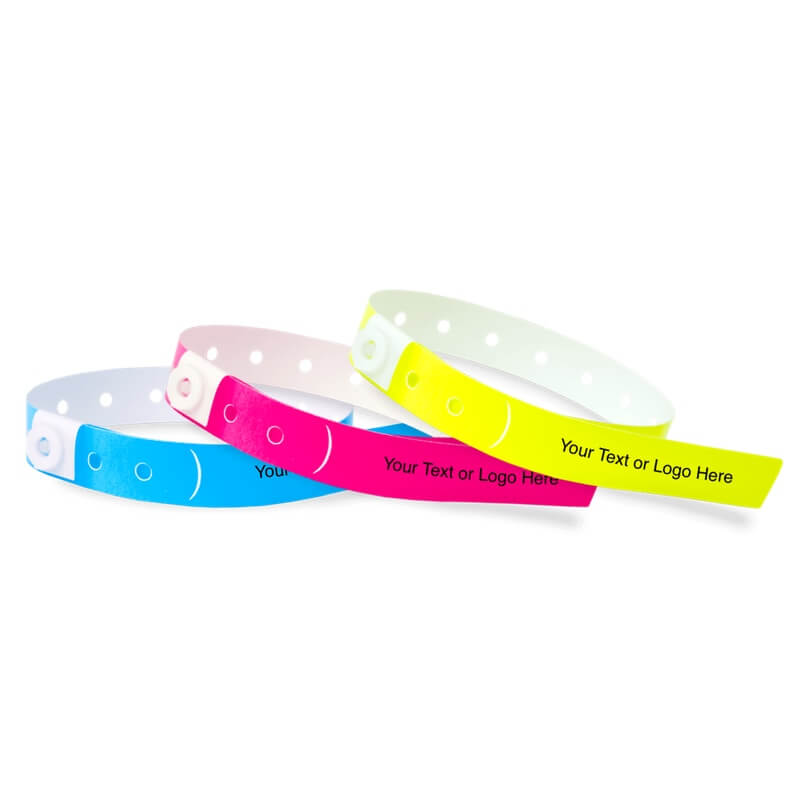 Slim plastic wristbands with a placeholder to show where you can customize the wristband shown in neon blue, neon pink and neon yellow 