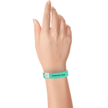 Hand wearing slim plastic wristband with a placeholder to show where you can customize the wristband shown in aqua