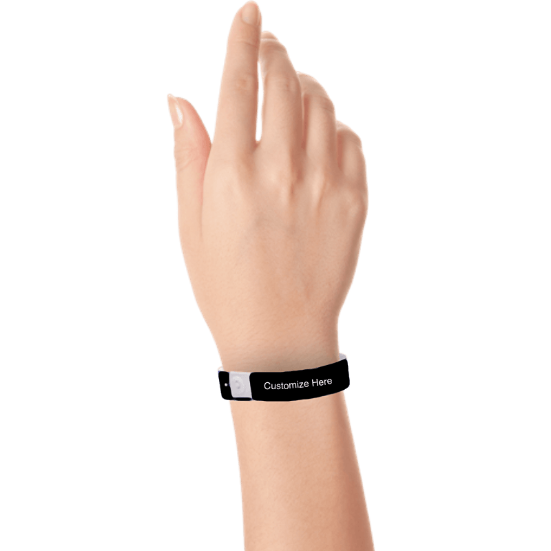 Hand wearing slim plastic wristband with a placeholder to show where you can customize the wristband shown in black