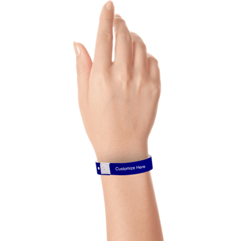 Hand wearing slim plastic wristband with a placeholder to show where you can customize the wristband shown in navy blue