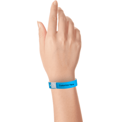 Hand wearing slim plastic wristband with a placeholder to show where you can customize the wristband shown in neon blue