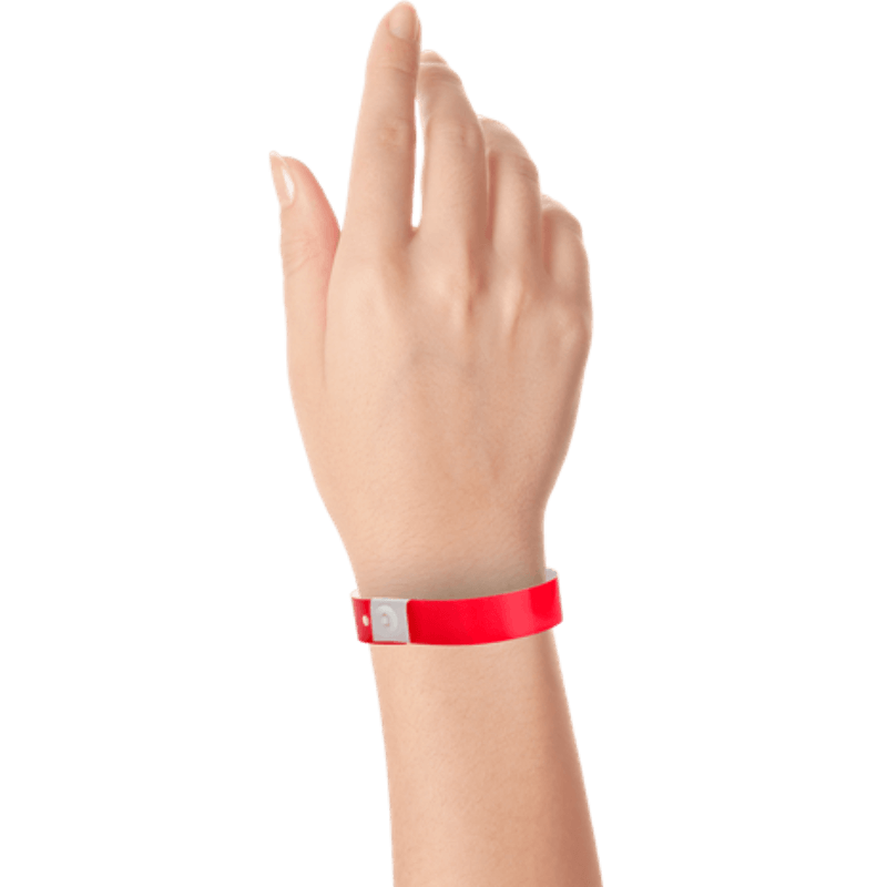 hand wearing plastic slim solid wristband in neon red 