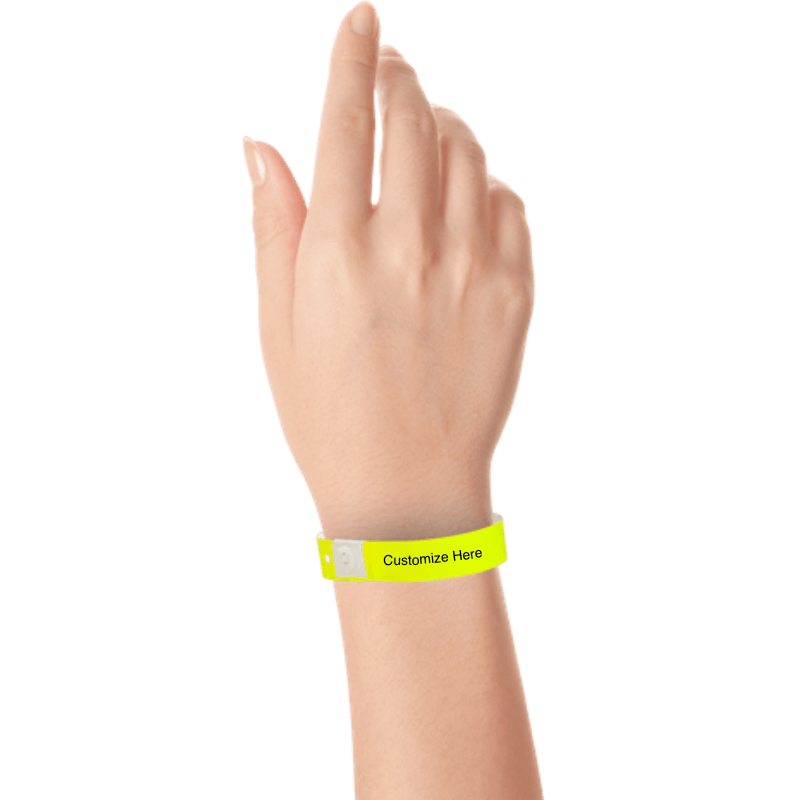 Hand wearing slim plastic wristband with a placeholder to show where you can customize the wristband shown in neon yellow