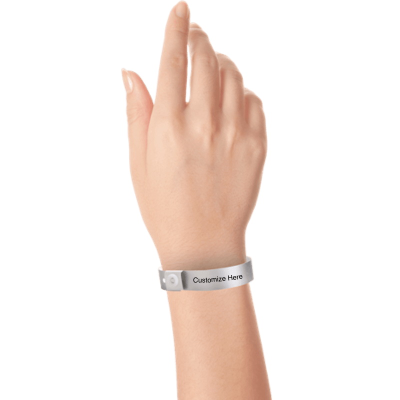 Hand wearing slim plastic wristband with a placeholder to show where you can customize the wristband shown in silver