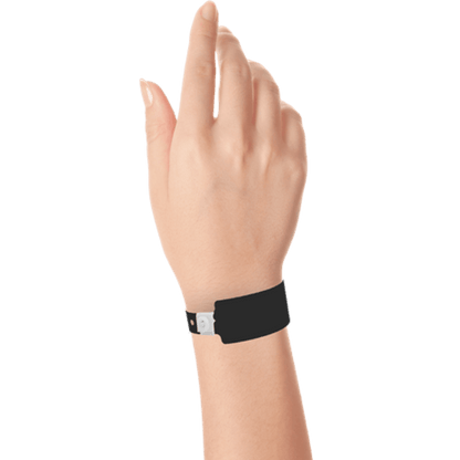 Wide face plastic solid wristband on hand in black
