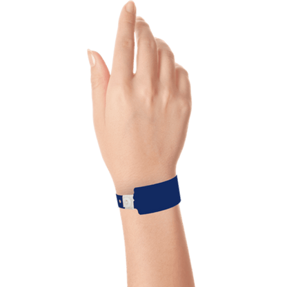 Wide face plastic solid wristband on hand in navy blue