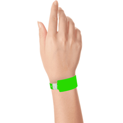 Wide face plastic solid wristband on hand in neon green