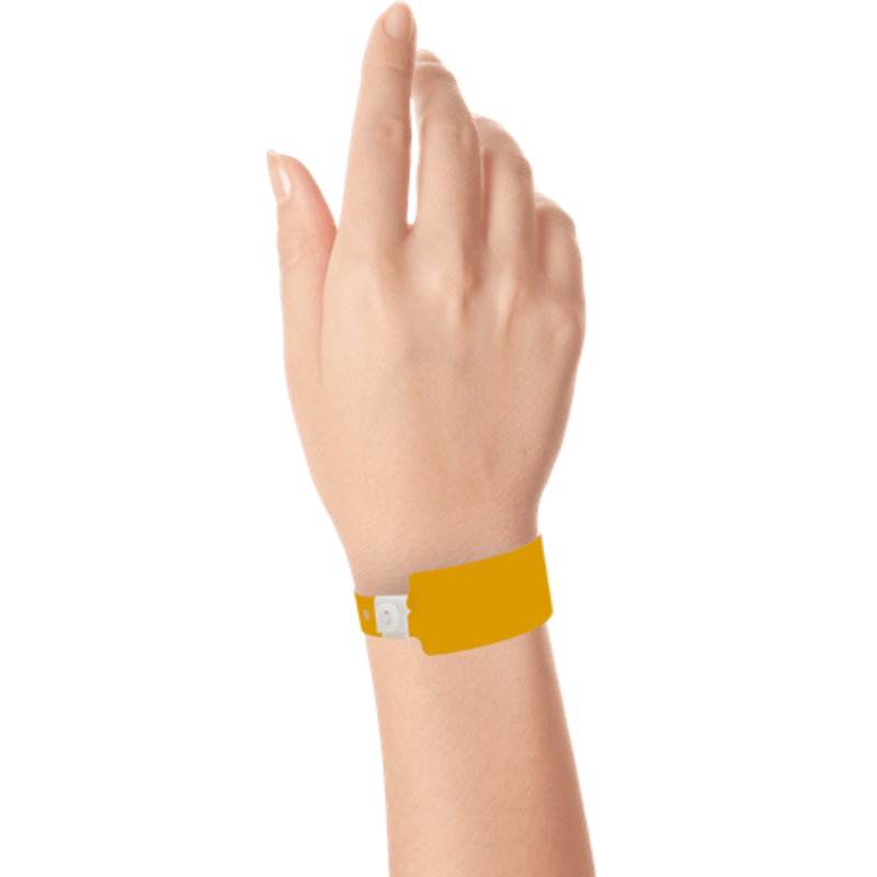 Wide face plastic solid wristband on hand in neon orange